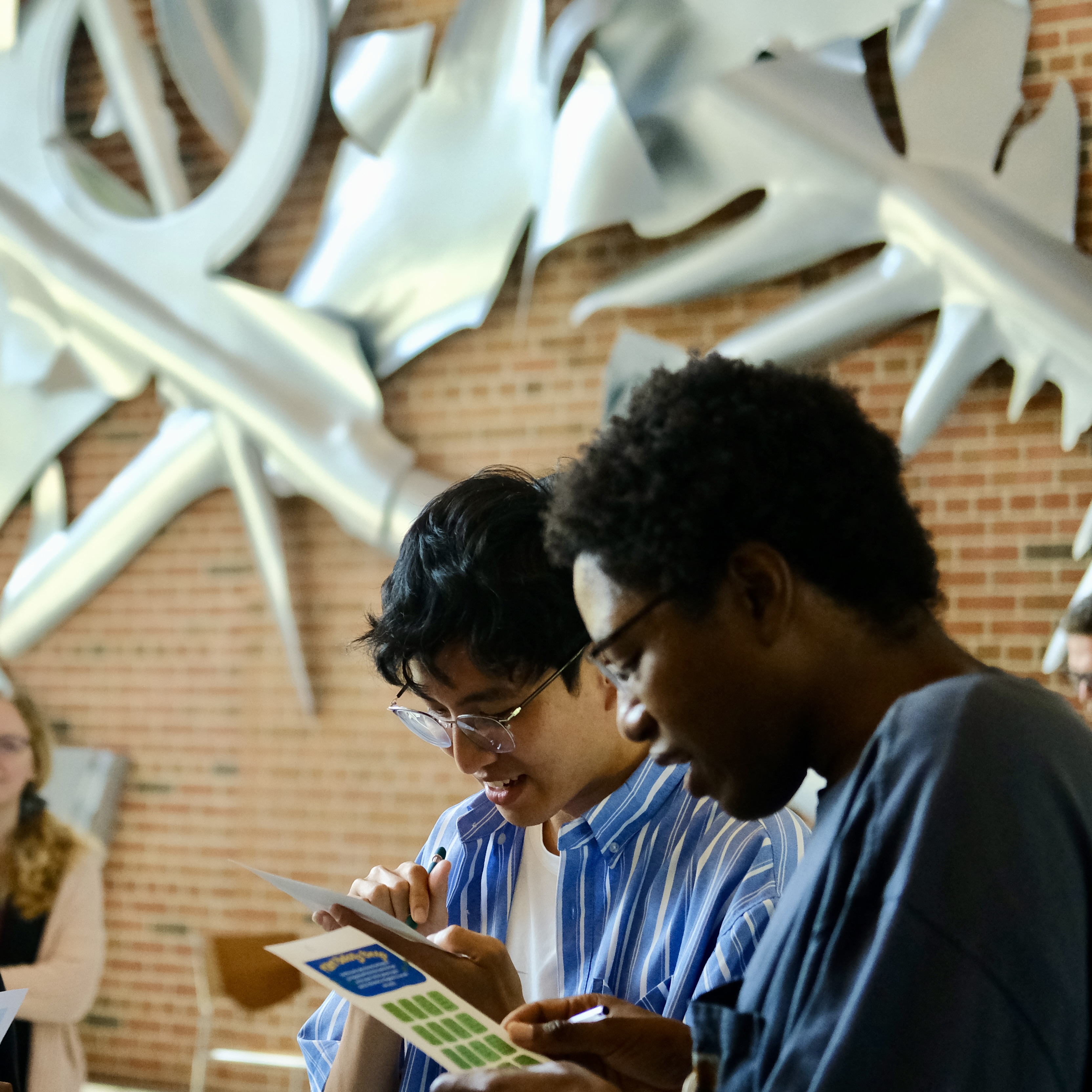 Grad students collaborate on a welcome activity