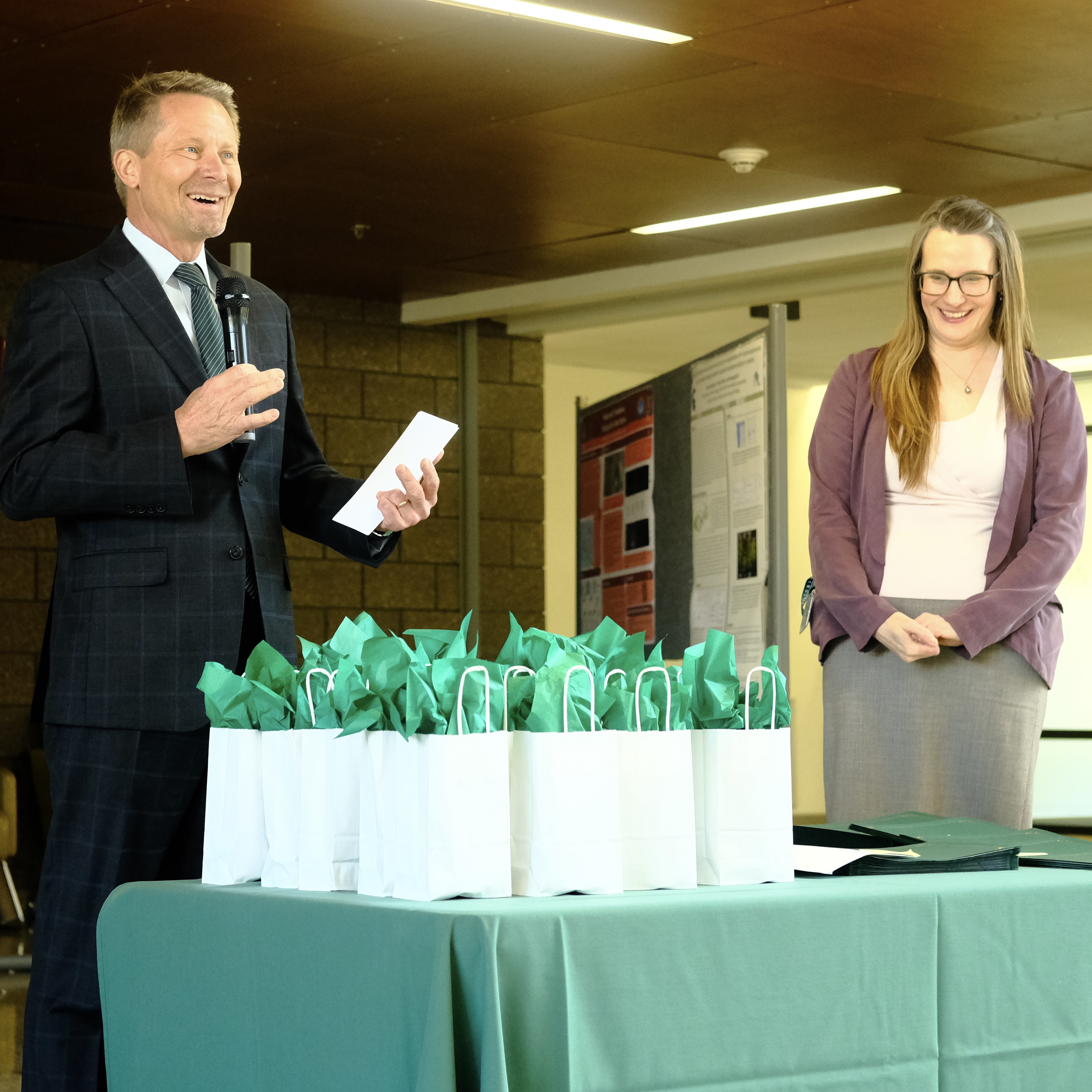 President Kevin M. Guskiewicz and Plant Biology Chair Andrea Case present awards at the PLB awards ceremony.