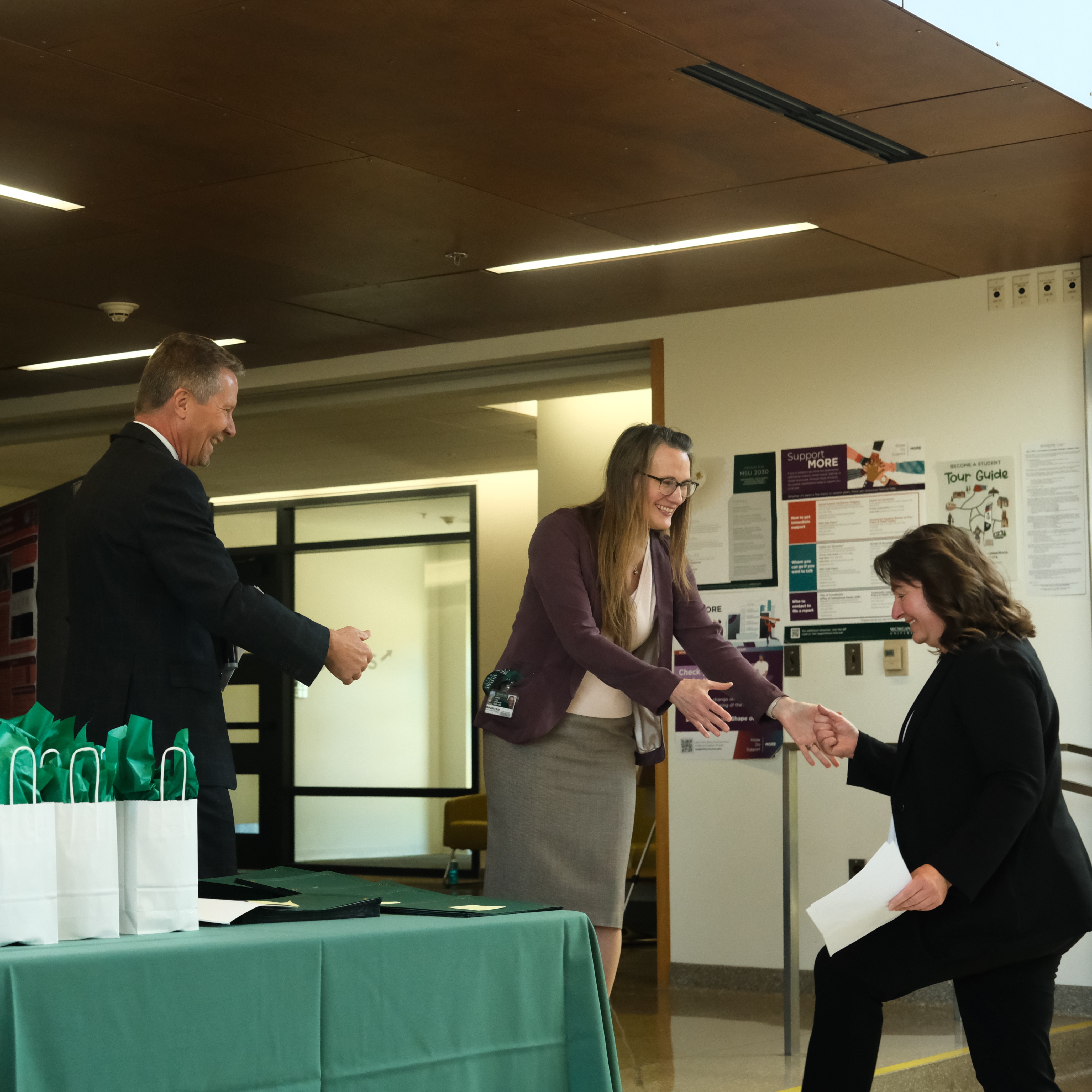 Long accepts her award from President Kevin Guskiewicz